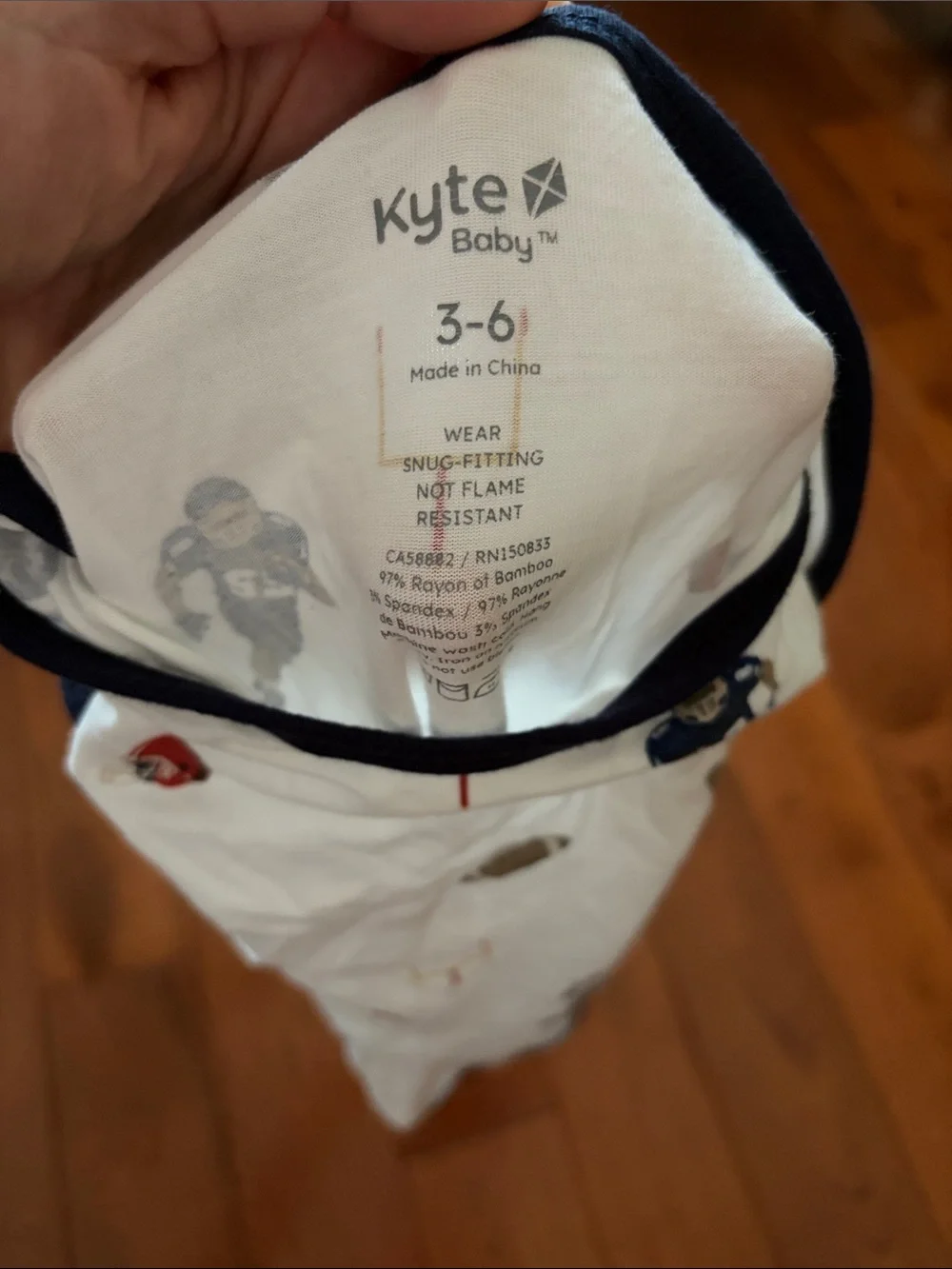 Kyte BABY White Football-Print Long Sleeve One-Piece with Navy Trim